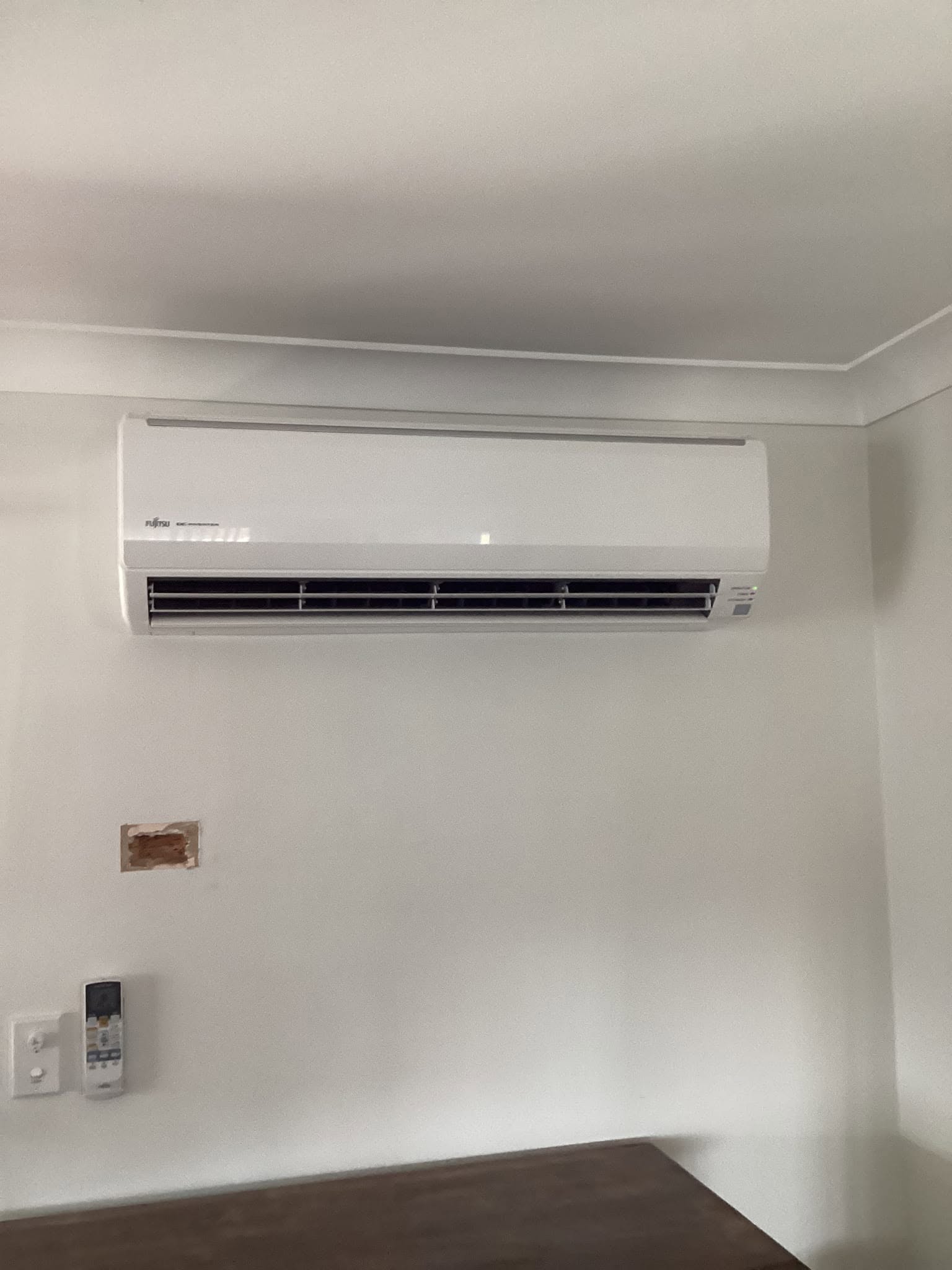 Fujitsu split-system air conditioner installed on an interior wall